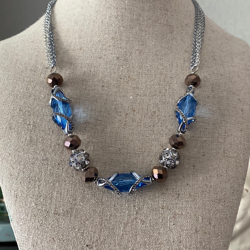 A beautiful silver, glass bead necklace in blue and brown